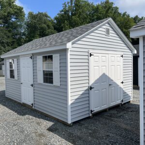 A light blue storage shed from The Olde Sale Barn