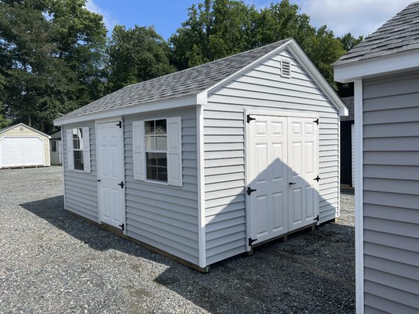 A light blue storage shed from The Olde Sale Barn