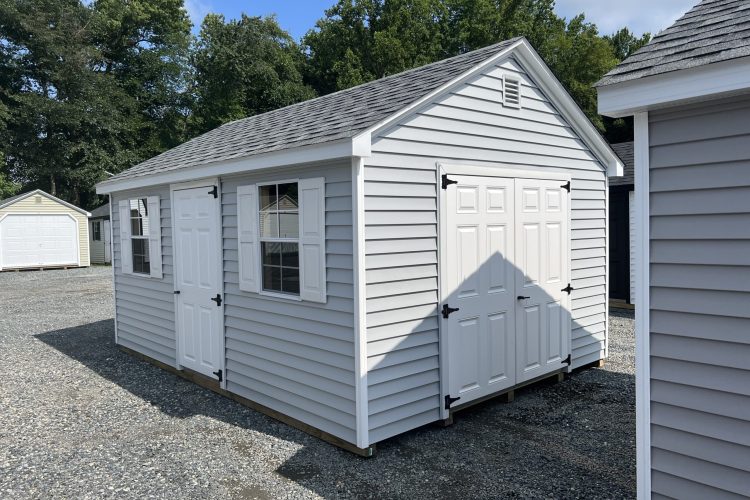 A light blue storage shed from The Olde Sale Barn